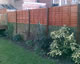 Panel fencing adds height to a wall